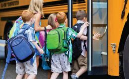 Kids boarding a school bus