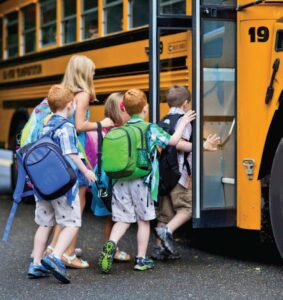 Kids boarding a school bus